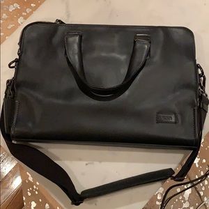 Tumi expandable black leather briefcase